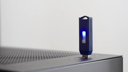 Man plugging and unplugging a USB flash drive. PC. Close up