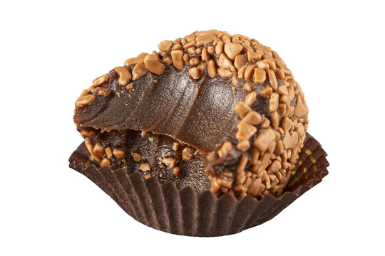 Brazilian fudge ball, traditional Brazilian sweet, isolated and bitten.