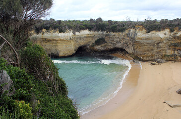 Beach, sea and rock formations at Loch Ard Gorge on the Great Ocean Road in Victoria, Australia