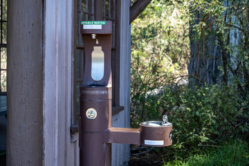 Outdoor, environmentally friendly, water bottle filling station and drinking fountain outside the...