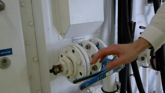 Ships crew close valve after filling freshwater on ship