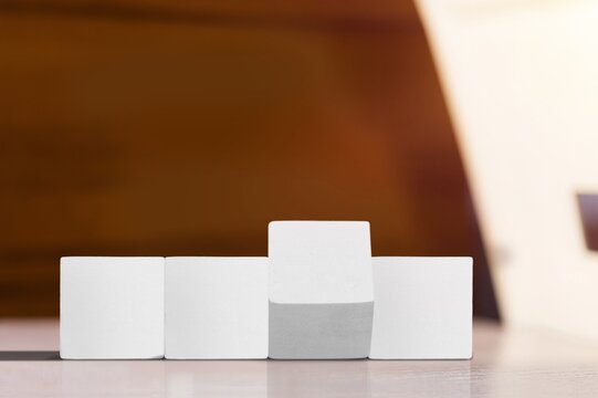 Hand turns wooden cubes changes the expression work to learn.