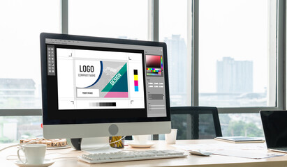 Graphic designer software for modern design of web page and commercial ads showing on the computer screen