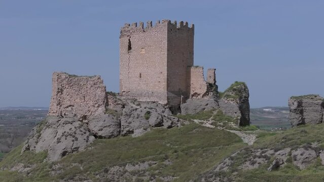 orbital flight over the castle of Oreja 9th century in the foreground the tower of the homenaje with a background of blue sky we see the ma of the magnificent location of the fortress Ontigola Spain