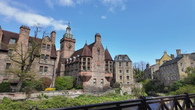 Walking Water of Leith Walkway, old houses in Dean Village, Edinburgh. Dolly right