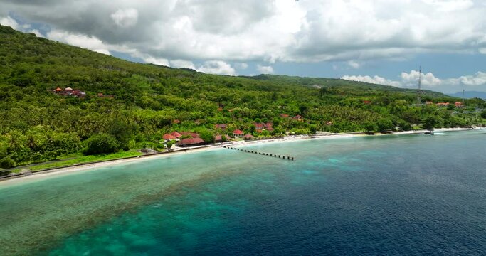 Dock across fringing reef on Village on Northern Coast of Nusa Penida Bali, aerial