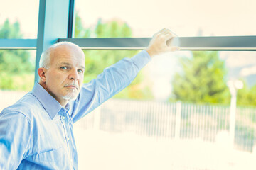 Elderly gentleman contemplates family and upcoming retirement