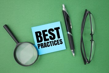 pen, glasses, magnifying lens and colored paper with the words best practices