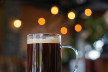 Coffee in a glass with bokeh on the background