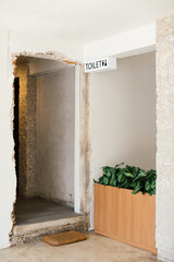 Bathroom entrance with white wall.