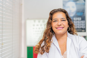 Portrait of an female latin Ophthalmologist in lab coat