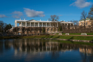 View of the Cameron Gallery with a reflection in the Mirror Pond of the Catherine Park in Tsarskoye Selo on a sunny spring day, Pushkin, Saint Petersburg, Russia