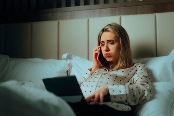 Pregnant Woman Working from home resting in Bed. Stressed mother to be overworking herself in...
