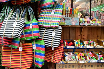 TW-01.30..24: Gaji bags, iconic in Taiwan, are not only popular locally but also garner international attention, often purchased by tourists as souvenirs, representing Taiwan's unique cultural blend.