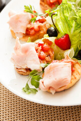 Bruschetta with tomato and ham