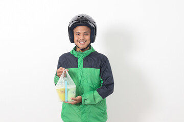 Portrait of Asian online taxi driver wearing green jacket and helmet delivering the beverages in plastic cup to customer. Isolated image on white background