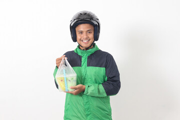 Portrait of Asian online taxi driver wearing green jacket and helmet delivering the beverages in plastic cup to customer. Isolated image on white background
