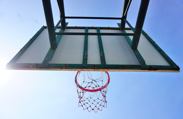 Basketball hoop at back side with blue sky, Sport theme © Beach boy 2024