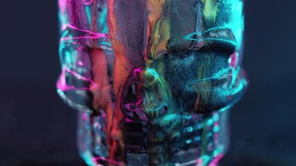 Paint skull. Glitter fluid spill. Occult witchcraft. Blur metallic colorful shiny texture ink drip scary skeleton head on dark black abstract art background. - Powered by Adobe