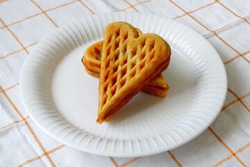 Heart shape of Plain Croissant Waffle or Croffle served in white plate