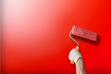 Painter is painting wall in red color