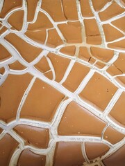 a photography of a close up of a tiled floor with a pattern.