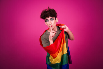 A funny guy in make-up is doing fitness. retro style. Pink background.