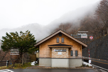 The fog that was forming had almost completely covered the mountains and trees