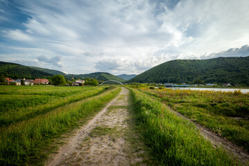 Panorama of the village of Porąbka seen from the walking path along Lake Czanieckie. Spring in the...