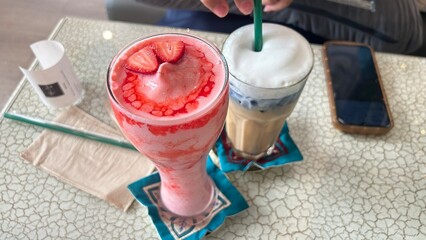 person holding a glass of milk