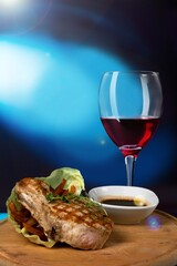 Red wine with tasty grilled meat in Restaurant