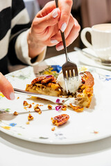 woman eating dessert in the restaurant