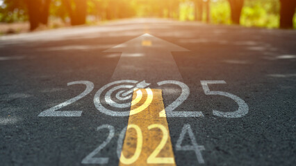 New year 2025 or straight concept. Text 2024, 2025, 2026 written on the road in the middle of the...