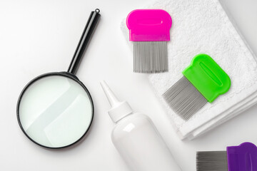 Medicine, lice comb and magnifying glass isolated on white