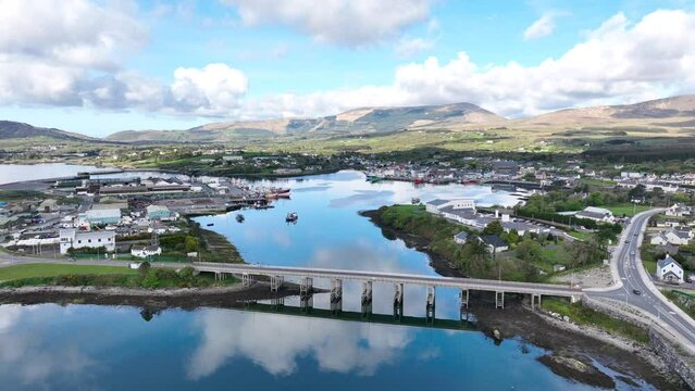 Drone fly over Castletownbere fishing port and town early morning on the Wild Atlantic Way Ireland gateway to west cork tourist destination