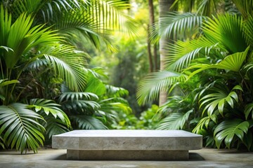 Fototapeta premium Empty stone podium in tropical garden background can be used for mocking up or display product to make advertising