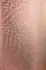 Fototapeta premium A modern vertical background featuring a textured metallic fabric in a rose gold color, with subtle 3D ripples and a reflective sheen.