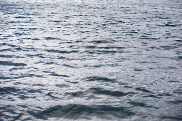 Water surface. The texture of the water. Waves on the lake in windy weather.