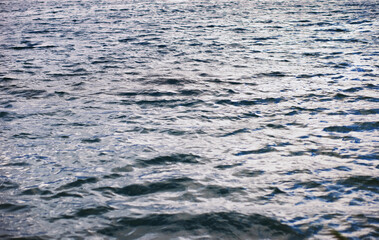 Water surface. The texture of the water. Waves on the lake in windy weather.