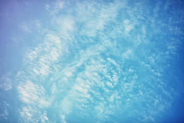 High clouds in the summer sky. Sky background. Meteorological observations of the sky.