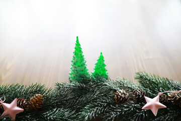 Christmas background with fir tree and decoration on dark wooden board