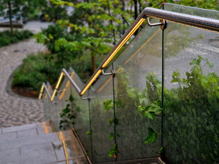 from the bottom of the handle is a recessed LED strip with a yellow light. the side of the stair...