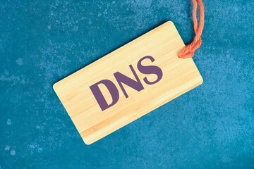 DNS Domain Name System Server Decentralized naming system for computers, devices, services, other resources on the card on an abstract background