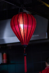 Colorful lanterns illuminate the restaurant, creating a vibrant atmosphere