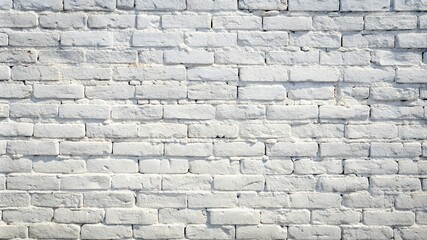 Aged white and gray brick wall with a textured and grungy appearance.