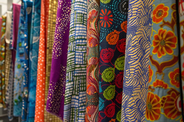 A vibrant display of textile arts showcasing intricate patterns and diverse fabric techniques, exemplifying traditional and contemporary craftsmanship 