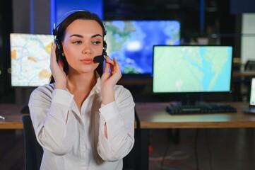 Photo of a successful dispatcher working on a computer in the office