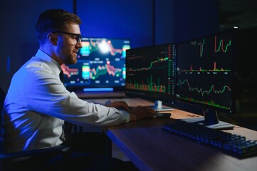 Crypto trader investor analyst looking at computer screen analyzing financial