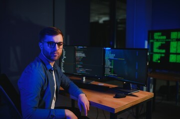 Smart Male IT Programer Working on Desktop