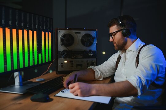 Secret agent listens on the reel tape recorder. Officer wiretapping in headphones. Spying of conversations. Intelligence gathering. Espionage concept